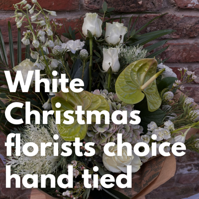 White Christmas Florists Choice - Hand Tied - Our expert, highly qualified florists will design a festive hand-tied filled with the finest quality white seasonal flowers, perfectly wrapped and delivered in water.